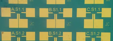 Top-down optical microscope image of several of metal/insulator/metal "MIM" tunnel diodes.